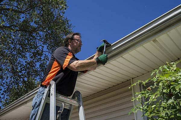 we use specialized equipment such as gutter scoops, ladders, and safety harnesses for gutter repair